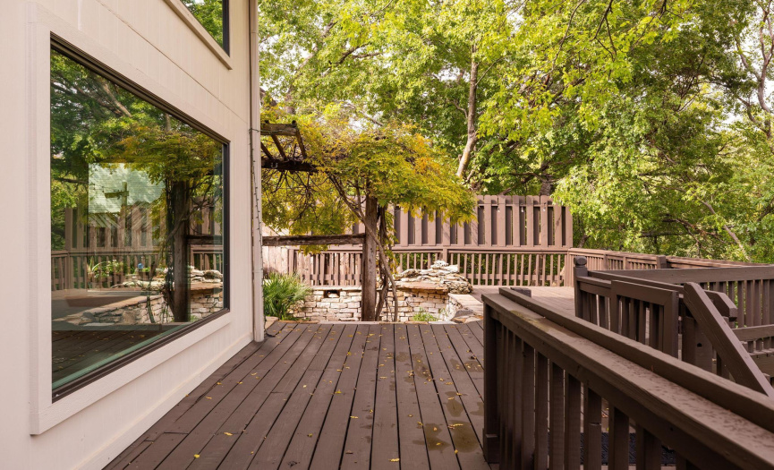 Expansive deck leading to lower yard