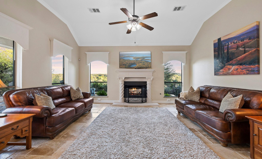 Comfortable family room with loads of natural light and a unique fireplace for cool Texas evenings