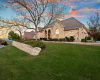 Two tiered lawn highlight this one of a kind 1 story home.  