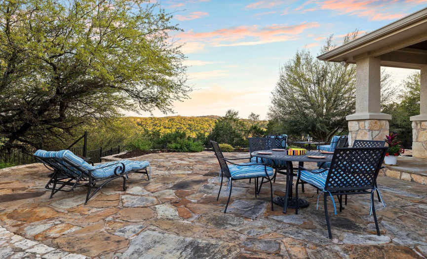 As if that was not enough...Expansive stone patio perfect for entertaining or relaxing, featuring stunning views of rolling hills