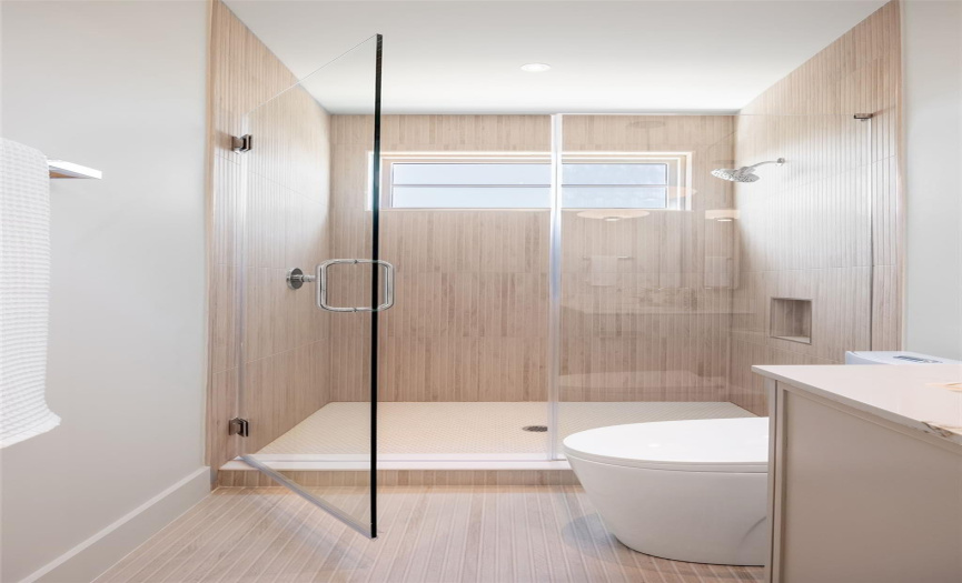 Primary bathroom with glass shower.