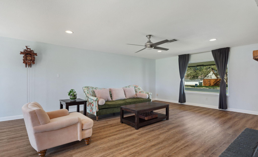 Plenty of room for seating arrangements and entertainment in this versatile living area.