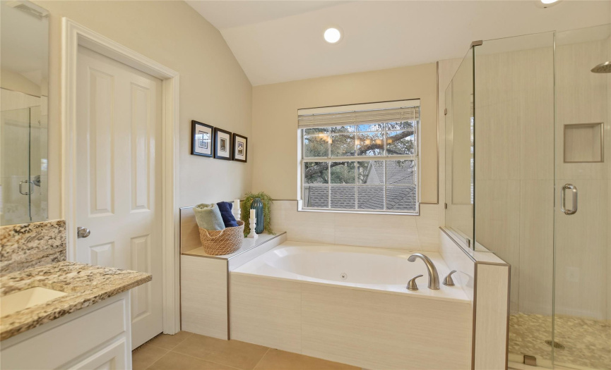 Master bath with walk-in shower and tub.
