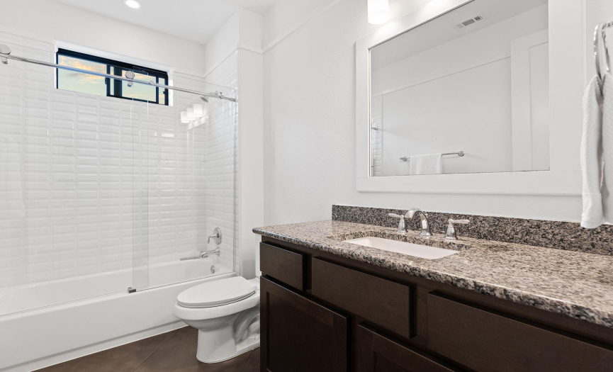 Bathroom 4 is perfect for guests, and is located just off the 4th bedroom/flex room.