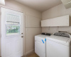 Washer / dryer area is between garage and door to back yard.  Both appliances convey.