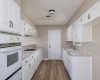 Galley kitchen has original cabinets / countertops, leaving a great opportunity for the new owner to remodel.  The door leads to an oversized two-car garage with work space.