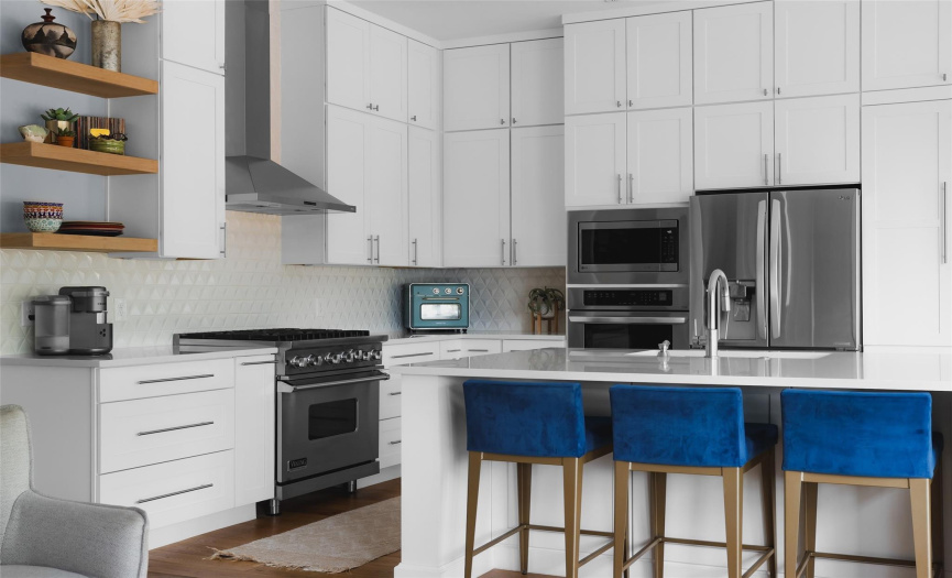 Recently installed viking range, stainless oven, and microwave complete the renovated kitchen