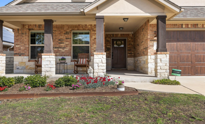 Charming front flower bed and front porch!