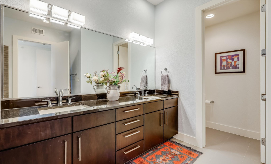 The primary bath is quite expansive with double vanities and granite counters in addition to the garden tub and separate walk-in shower.