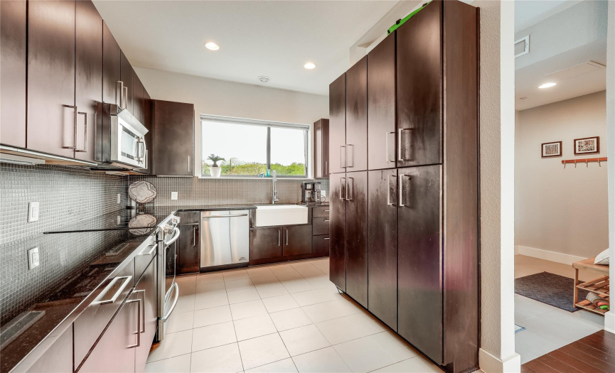 If you love to create tasty meals, this is the kitchen for you -- ample counter space, stainless appliances and lots of storage for all your cooking wares.