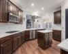 gourmet kitchen with kitchen Island and lots of beautiful cabinets