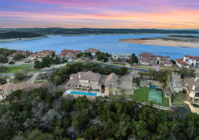 Gorgeous estate-sized lot in Lakeway/Lake Travis ISD. Over 9,000 square feet, sport court, guest quarters, 4.5-car garage, pool and more. *pool water digitally added for photo, pool has been re-plastered as of March 2024.
