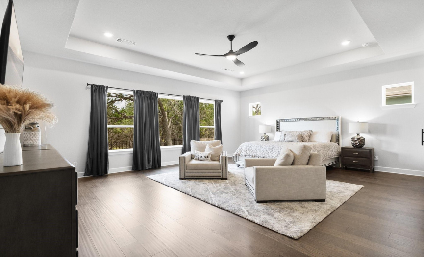 Bask in the natural light that floods the main bedroom through its generous windows, creating an inviting, bright, and airy ambiance—a perfect place to awaken refreshed.