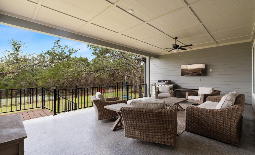 The spacious covered patio provides a lovely outdoor living area. The space is your perfect stage for hosting unforgettable gatherings and creating lasting memories.