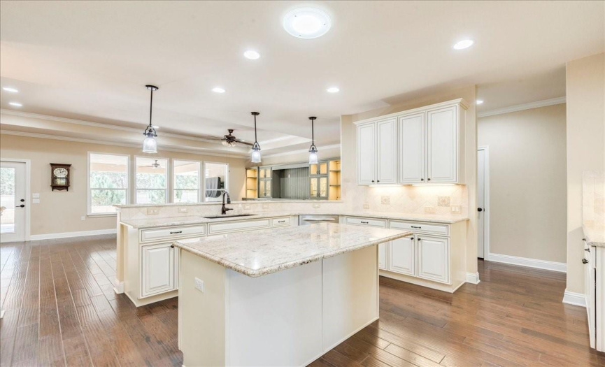 This eat in kitchen has ample space and beautiful granite countertops. 