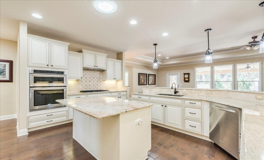 Kitchen features a built in Kitchenaid microwave, oven and gas 5 burner range. 