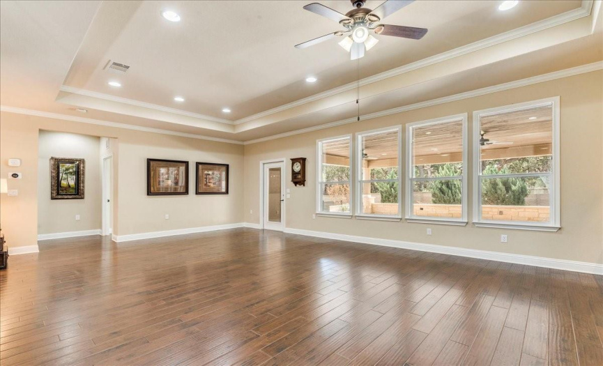 Large family room overlooks the backyard and covered porch. 