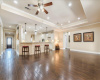 Wood floors and tray ceilings throughout this home gives it so much charm and style. 