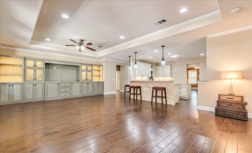 This family room has a floor plan open to the eat in kitchen for easy entertaining. 