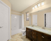 Primary en-suite bath features double vanity