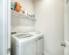 Large laundry room with shelving