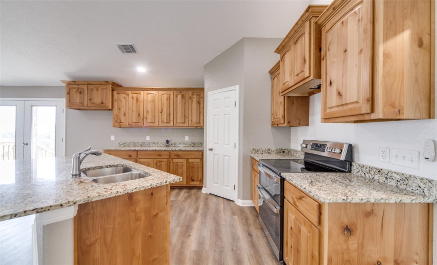 Beautiful knotty pine cabinets and granite counter tops.