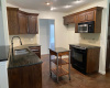 The kitchen has ample counter space and a good amount of storage.