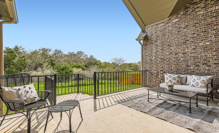 Enjoy your morning coffee or evening beverage on your covered back patio.