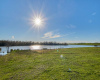 Enjoy beautiful sunsets on this lakefront property