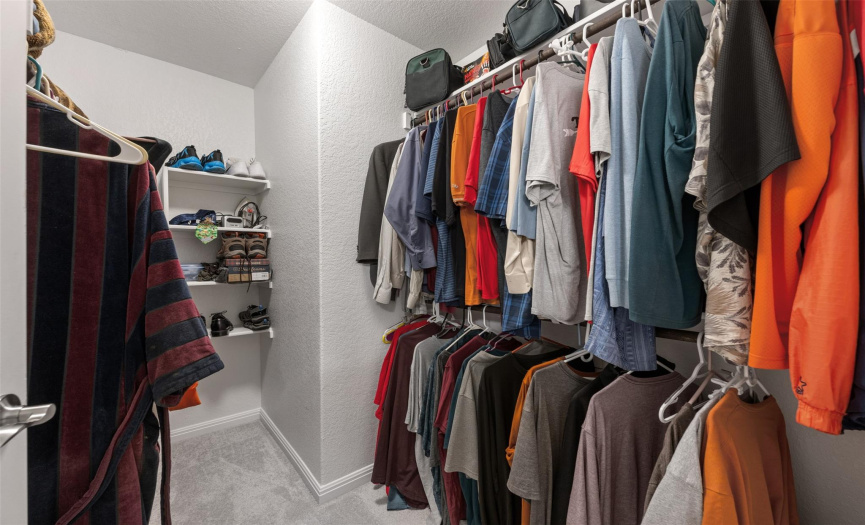 Large walk in closet within the primary bathroom.