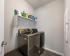Enclosed laundry room has it own spacious area to work within.