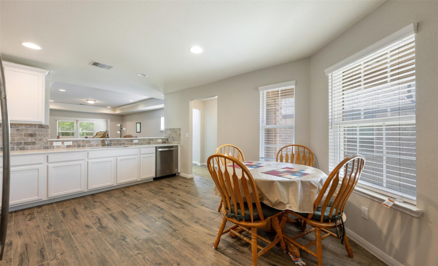 The kitchen offers space for a small dining table!