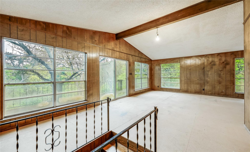 The upstairs open living area with magnificent views of the woods.