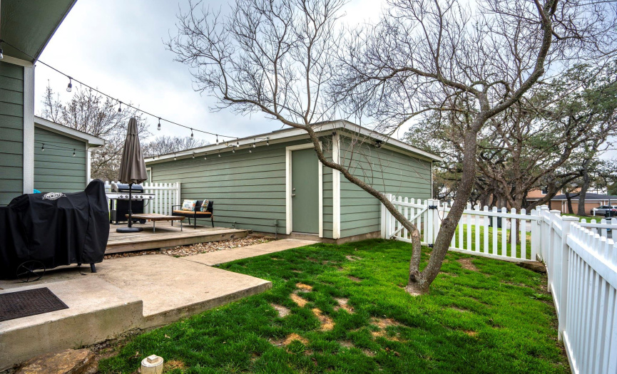 Backyard, fenced in with an oversized back deck. Great for entertaining outside. 
