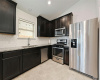 Modern finishes on the kitchen, with stainless steel appliances (refrigerator available to convey).