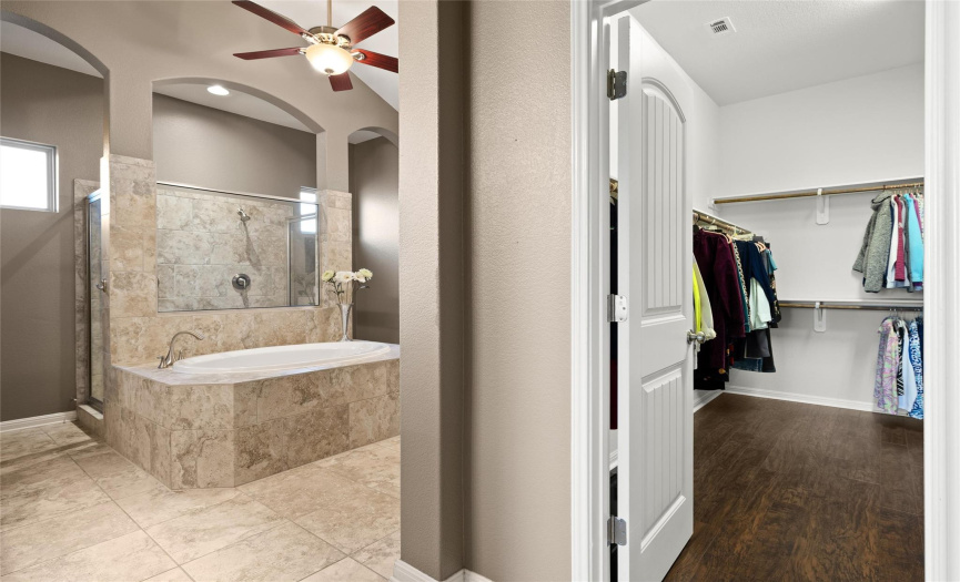 Large walkin closet with very tall ceilings