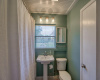Step into the charming primary bath, a serene retreat adorned with elegant fixtures and offering a relaxing ambiance.