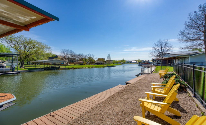 Whether you're sunbathing by the waterside or relaxing on the covered porch, this waterfront retreat offers the perfect setting for unwinding and embracing the joys of lakeside living.