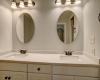 Double granite vanity in primary bathroom