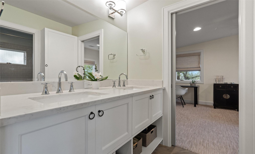 This beautiful full bathroom with dual vanities is located between secondary bedrooms #3 & #4.