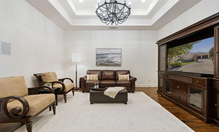 Downstairs media room or extra den for entertaining and separating entertaining areas