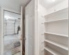 Pantry closet and entry door to the garage with washer and dryer