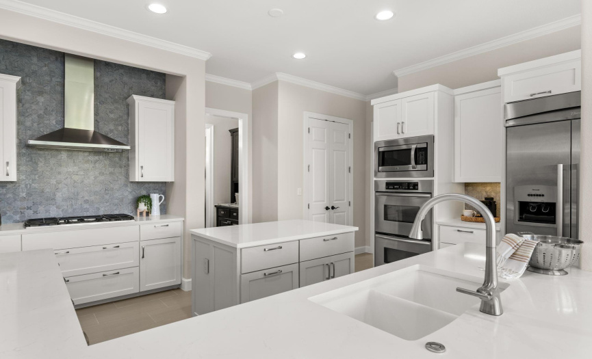 High-end appliances, a butler's pantry, and a new backsplash create a chef's dream kitchen.
