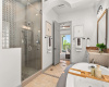 The primary bathroom features an oversized walk-in steam shower.