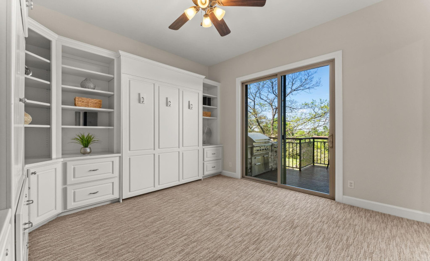 The first-floor guest bedroom has access to the outside deck area.