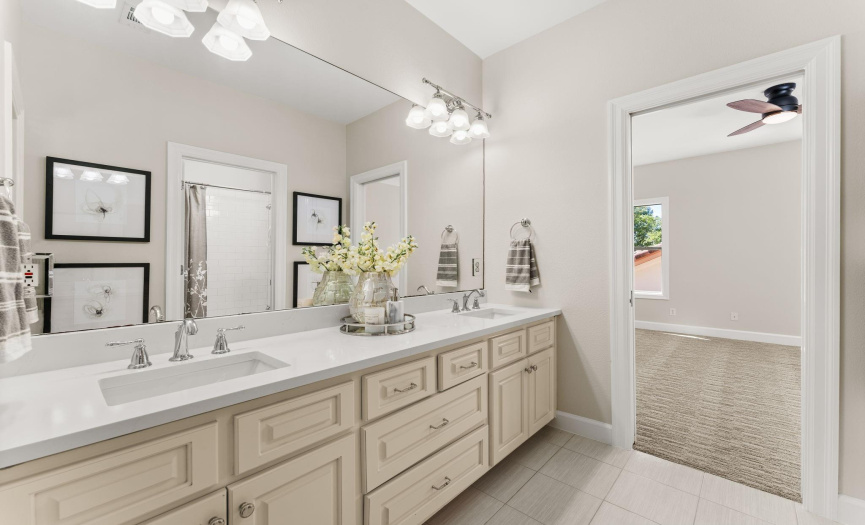 Jack and Jill bathroom services secondary bedrooms #2 and #3 and features new countertops.