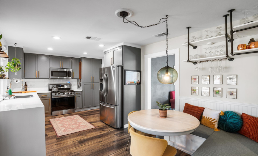 The built-in Breakfast area is just perfect for your morning meal. The custom painted cabinets, quartz countertops built-in shelving and more make this kitchen very cooks dream!