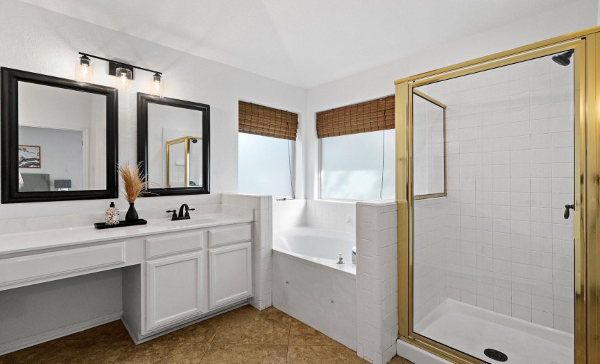 Enjoy the spa-like ambiance of the primary bathroom, complete with elegant fixtures, stylish finishes, and a serene color palette.