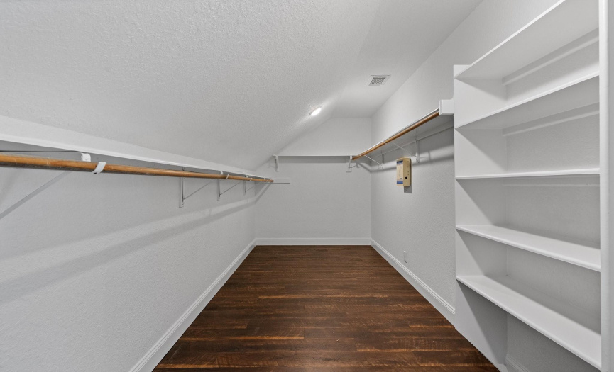 The primary bedroom includes a spacious walk-in closet, offering plenty of storage space for your wardrobe essentials.