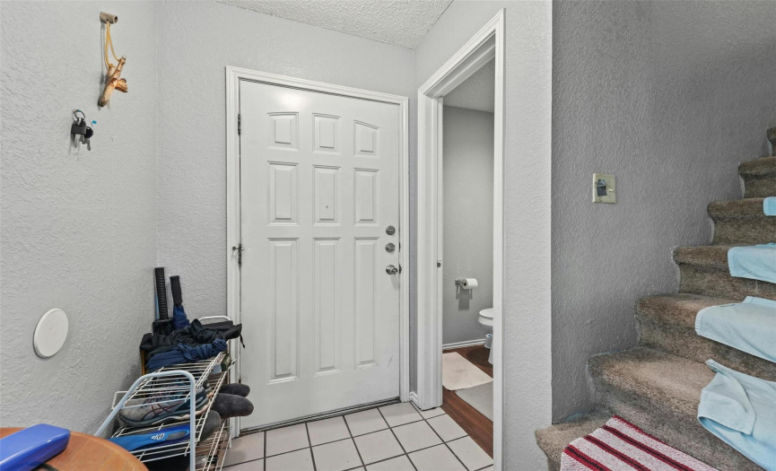 Convenient main floor guest powder room off the front entryway. 